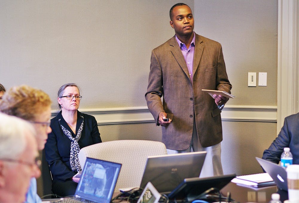 <p>Associate Professor at North Carolina Central University Antonio Baines (right), speaks at the Faculty Executive meeting on Monday.</p>