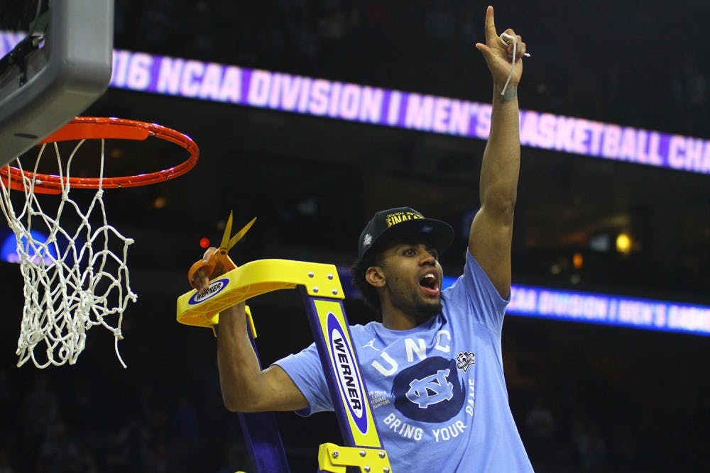 Sophomore&nbsp;Joel Berry helps cut down the net after the 88-74 Elite Eight win against Notre Dame.&nbsp;