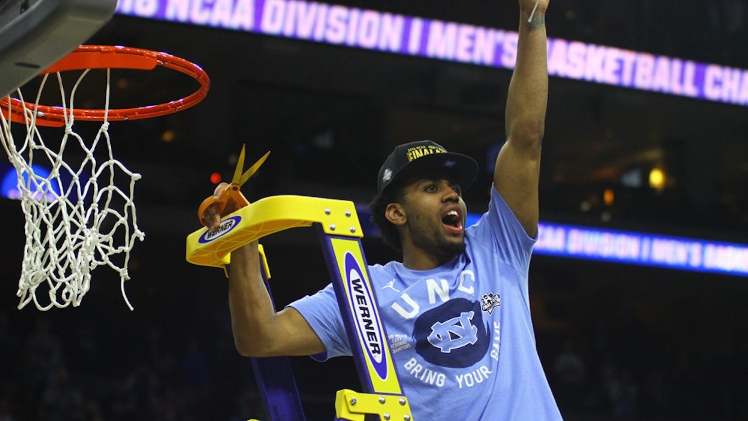 Sophomore&nbsp;Joel Berry helps cut down the net after the 88-74 Elite Eight win against Notre Dame.&nbsp;