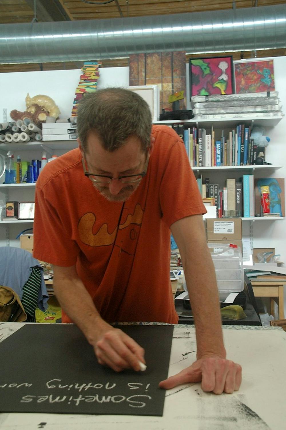Artist and contributor to the inaugural edition of “Welcome: Art in Your Home,” Warren Hicks, works in his studio.Photo courtesy of Open Art Society. 