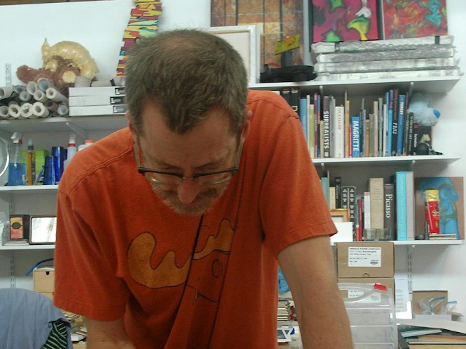 Artist and contributor to the inaugural edition of “Welcome: Art in Your Home,” Warren Hicks, works in his studio.Photo courtesy of Open Art Society. 