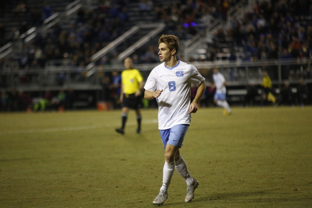 <p>Junior forward Jack Skahan (8) jogs during the game against Duke on Tuesday, Oct. 23, 2018 in Koskinen Stadium. Skahan scored the lone goal for UNC to clench the ACC Coastal Division Title.</p>
