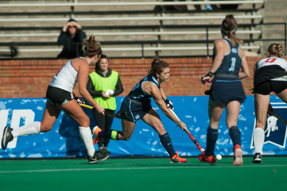 <p>Senior midfielder Yentl Leemans (18) hits the ball in the championship game against Princeton on Sunday, Nov. 24, 2019. UNC beat Princeton 6-1, finishing the year 23-0 and claiming their eighth national title.</p>