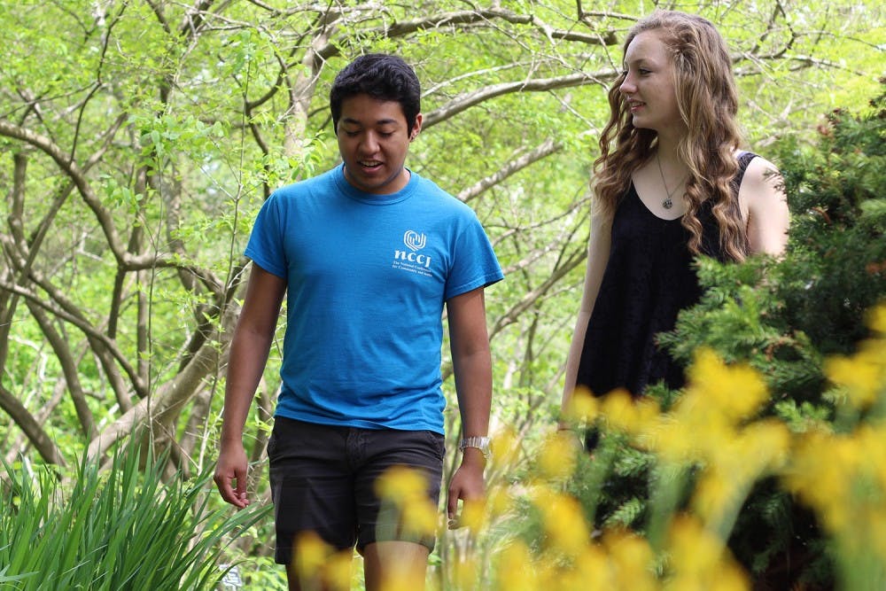 <p>UNC-CH freshmen Cesar Rodriguez and Alex Blackburn walk through the Coker Arboretum Monday. They were close friends with Anna Smith.</p>