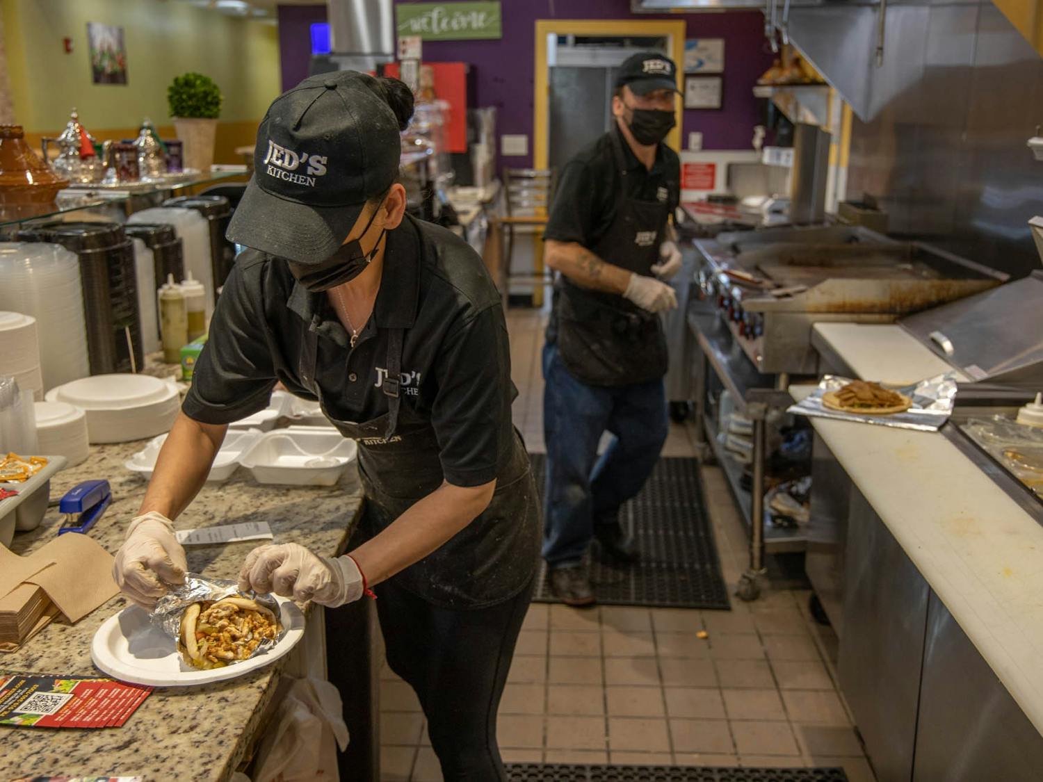 Zaina Haj Ali of Jed's Kitchen prepares an online order on Wednesday, March 3, 2021. The Moroccan and Meditteranean grill opened in December on Franklin Street.