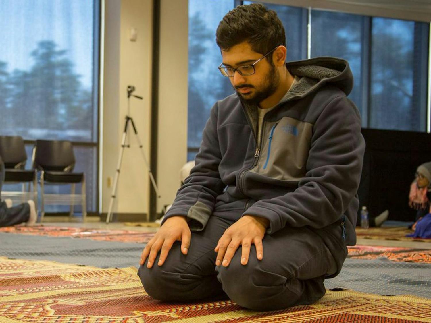 UNC sophomore Zeshan Bari prays during the UNC Muslim Students Association’s weekly prayer held every Friday in the Student Union annex.