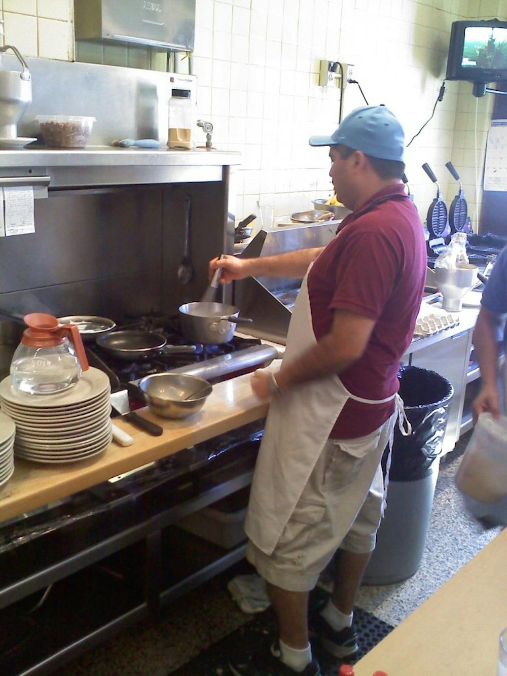 	<p><span class="caps">DTH</span> / Eric Pesale</p>

	<p>Line cook Carlos Hernandez whisks eggs for a breakfast plate at Ye Olde Waffle Shoppe.</p>