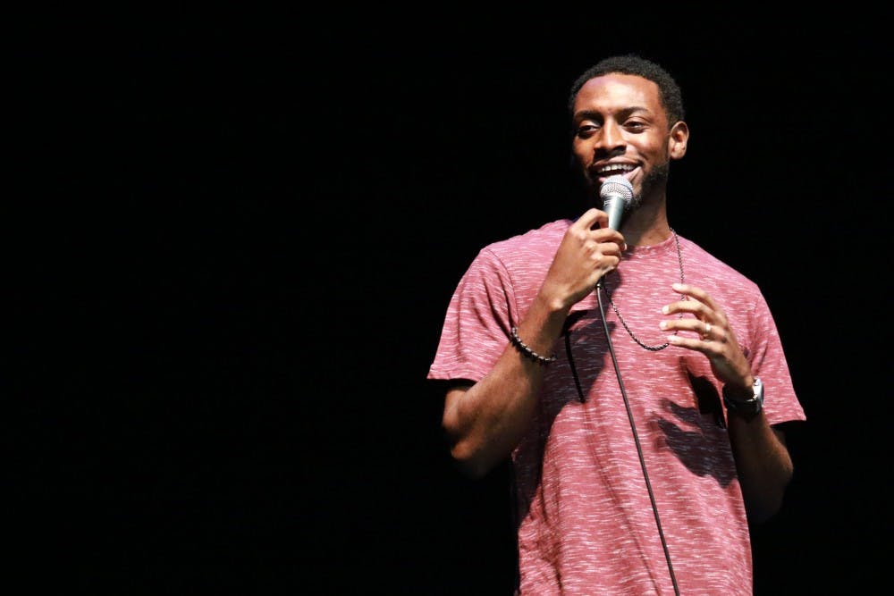 Opener AJ Foster performs stand-up during the Homecoming Comedy Show Tuesday night in Memorial Hall. 