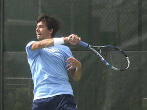 Andrew Gores returns a volley during the UNC team’s victory over Clemson.