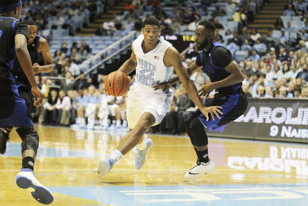 UNC sophomore  Isaiah Hicks drives past a Fayetteville State defender Friday. 