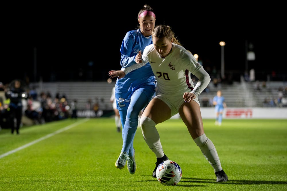 <p>UNC junior forward Talia DellaPeruta (24) fights for the ball during UNC's game against FSU in the NCAA semifinals at WakeMed Soccer Park on Friday, Dec. 2, 2022.</p>
