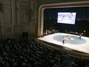 UNC wrestling squared off against NC State in the "Brawl at the Hall" on Monday night. The match took place on the stage in Memorial Hall.