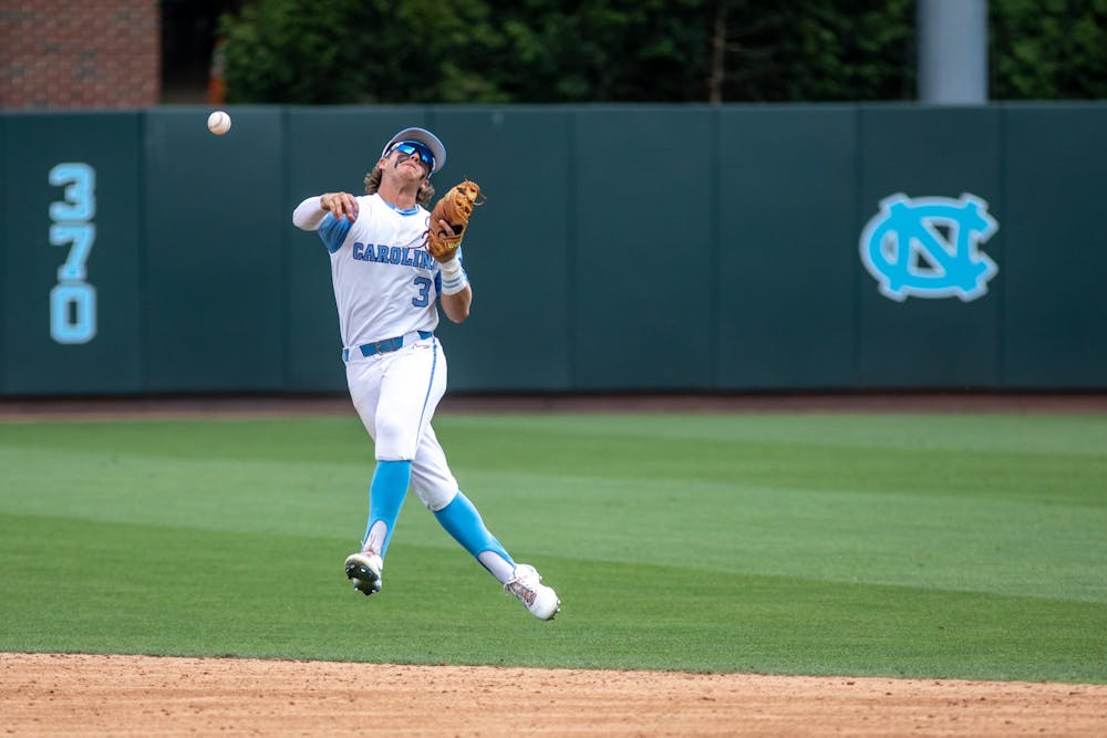 Sophomore infielder Colby Wilkerson (3) fields a ground ball and throws to first for the out during the second inning of UNC's NCAA Regional against Hofstra at Boshamer Stadium on Friday, June 3, 2022. UNC won 15-4.