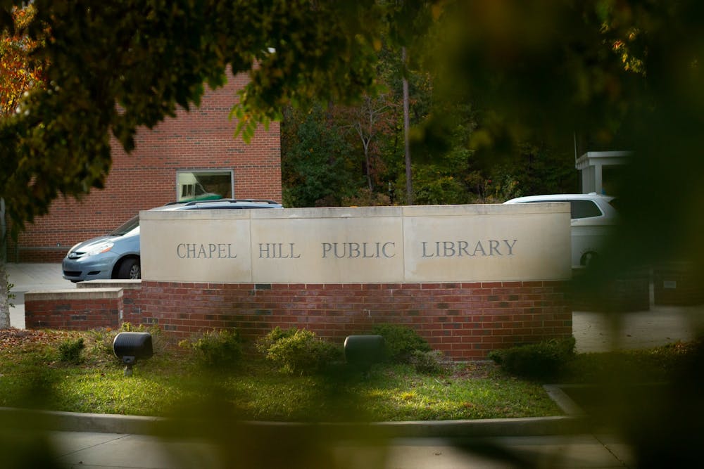 The Chapel Hill Public Library, pictured on Tuesday Oct. 20th, has been awarded with a federal grant that funds computers, increased wifi coverage, and multilingual assistance throughout Chapel Hill.