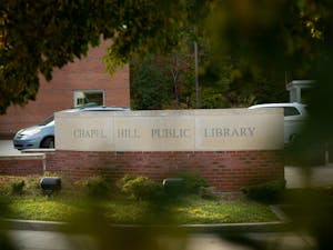 The Chapel Hill Public Library, pictured on Tuesday Oct. 20th, has been awarded with a federal grant that funds computers, increased wifi coverage, and multilingual assistance throughout Chapel Hill.
