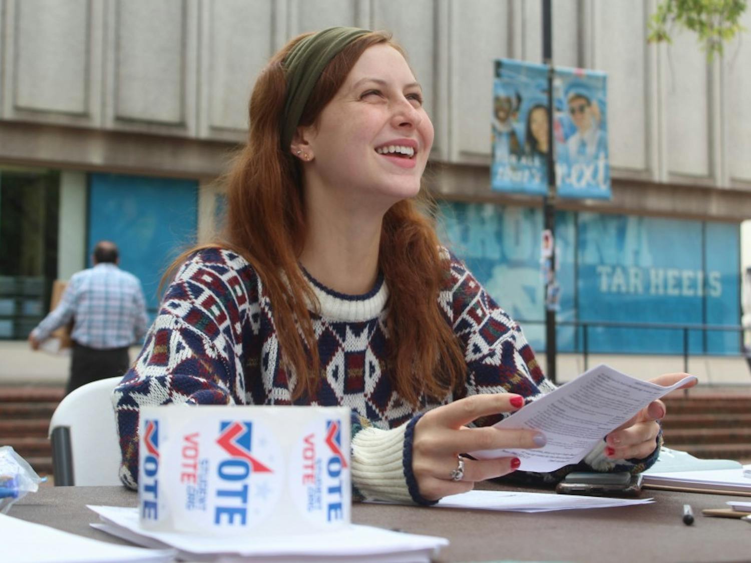 First-year Cassie Teixeira, exercise and sports science major, helping students at the voter registration drive on Wednesday, Oct. 9, 2019. Teixeira works for March For Our Lives UNC-CH. "Everyone has the right to vote and it's very important to use that right," Teixeria said.