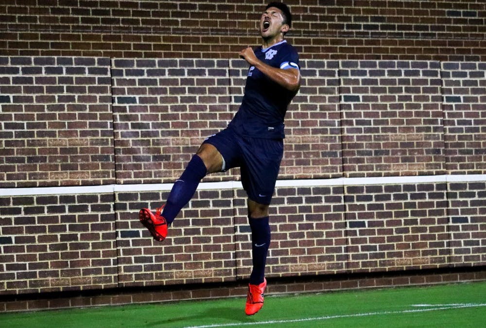 <p>Senior midfielder Mauricio Pineda (2) celebrates his first goal in the 3-1 win over West Virginia on Tuesday, Oct. 8, 2019 on Dorrance Field.&nbsp;</p>