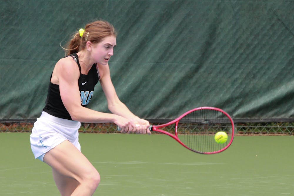 UNC first-year Fiona Crawley returns a volley during a singles' match on March 28, 2021 at Cone-Kenfield Tennis Center. The Tar Heels defeated the Fighting Irish 7-0.