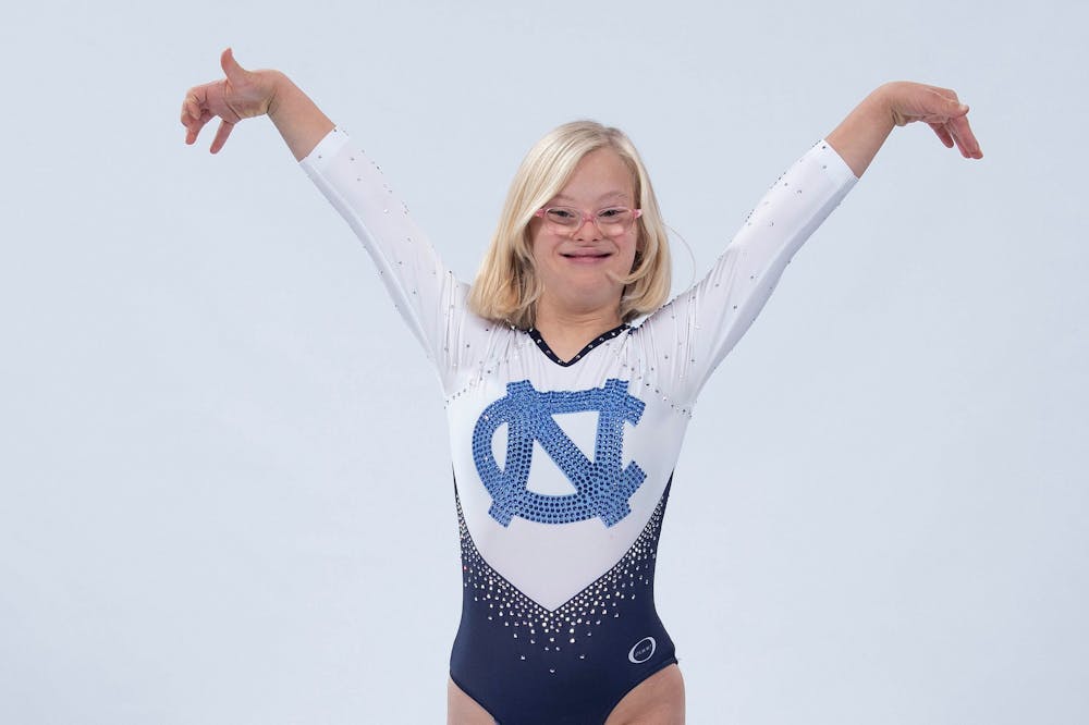 Thea Weinert, a local gymnastics fan, is an honorary member of the UNC gymnastics team. Photo courtesy of UNC Athletic Communications/Jeffrey A. Camarati. 
