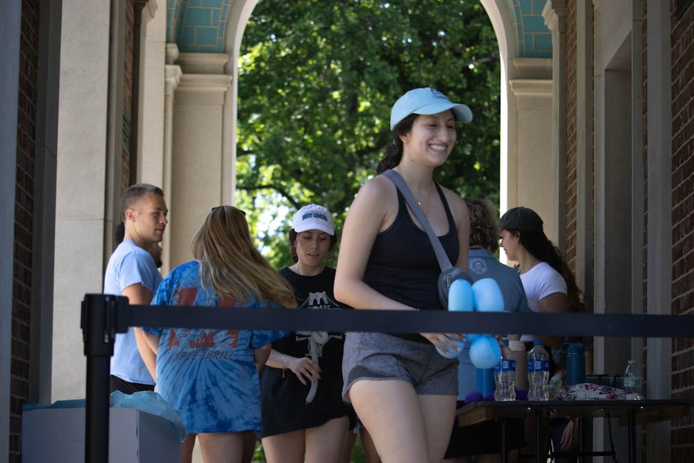 <p>UNC seniors exit the Bell Tower during the annual climb, hosted by the UNC General Alumni Association on Monday, April 19. The event is an iconic tradition for graduating seniors at UNC.</p>