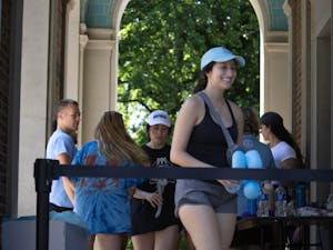 UNC seniors exit the Bell Tower during the annual climb, hosted by the UNC General Alumni Association on Monday, April 19. The event is an iconic tradition for graduating seniors at UNC.