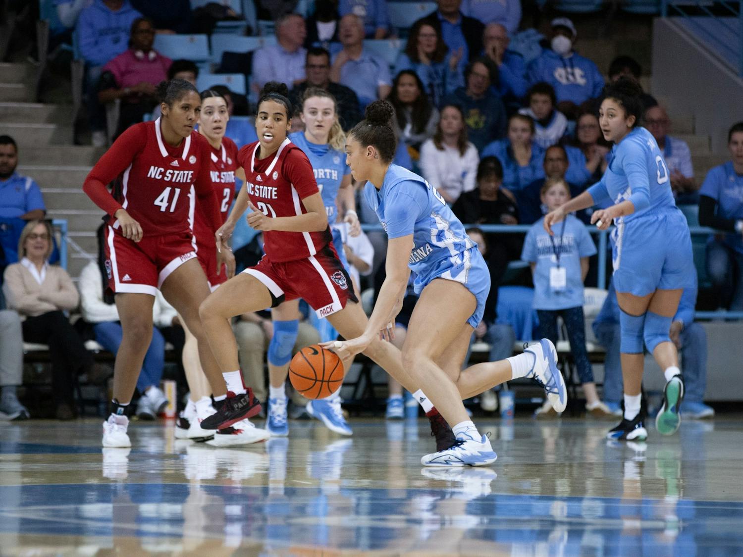 UNC sophomore guard /forward Destiny Adams (20) dribbling the ball during the women's basketball game against the NC State Wolfpack in Carmichael Arena on Sunday, Jan. 15, 2023. The Tar Heels won 56-47.