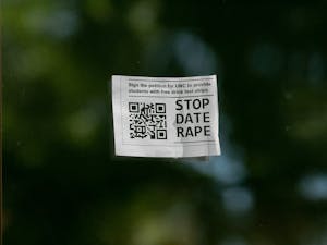 Signage prompting passerbys to sign a petition against date rape is pictured around UNC-Chapel Hill's campus on Oct. 7, 2022.&nbsp;