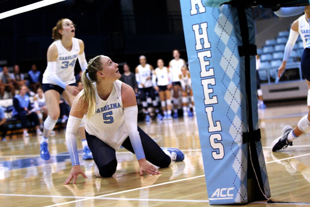 UNC outside hitter Charly Niego (5) saves the ball on Sept. 2, 2022.
