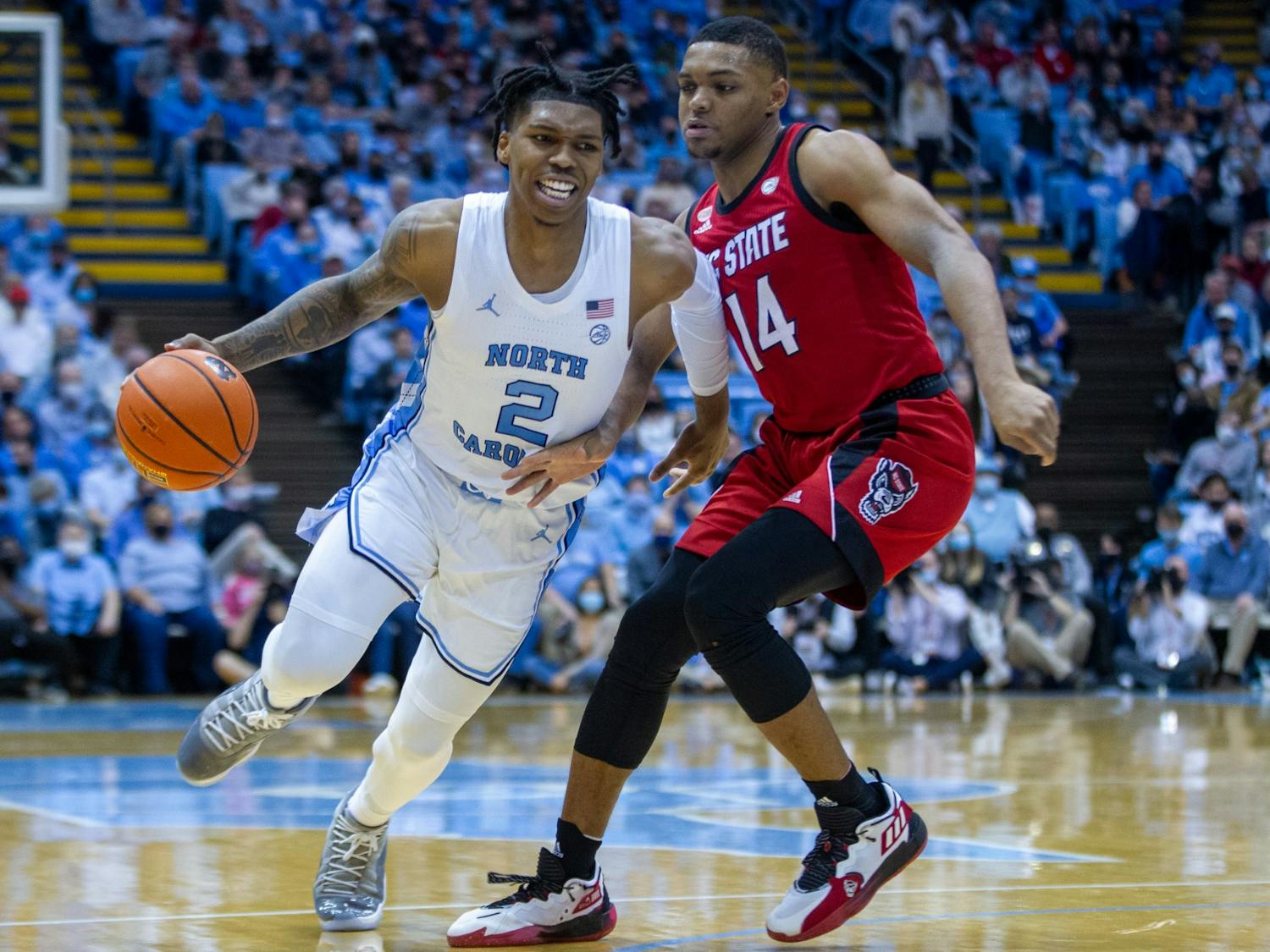 Sophomore guard Caleb Love (2) runs with the ball at the game against NC State at the Smith Center in Chapel Hill on Jan. 29, 2022. UNC won 100-80.