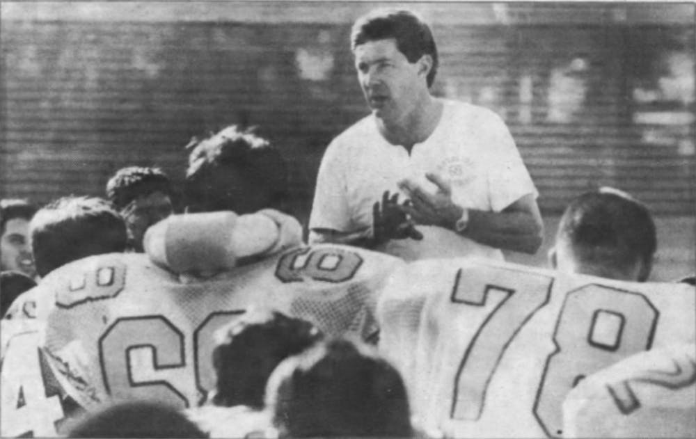 UNC head football coach Mack Brown speaks in front of his team in 1989.