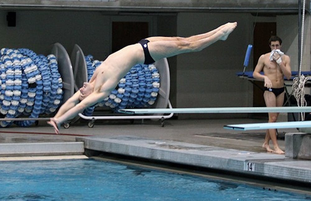 Jack Nyquist dives in Koury Natatorium at the match against NC State this past Friday night.