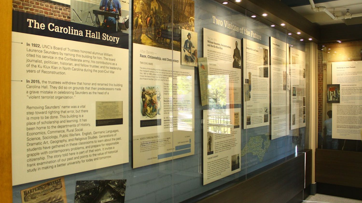 A permanent exhibit in the entrance of Carolina Hall detailing the building's history. The hall was originally named for William Saunders, former leader of the N.C. Klan and UNC Trustee.