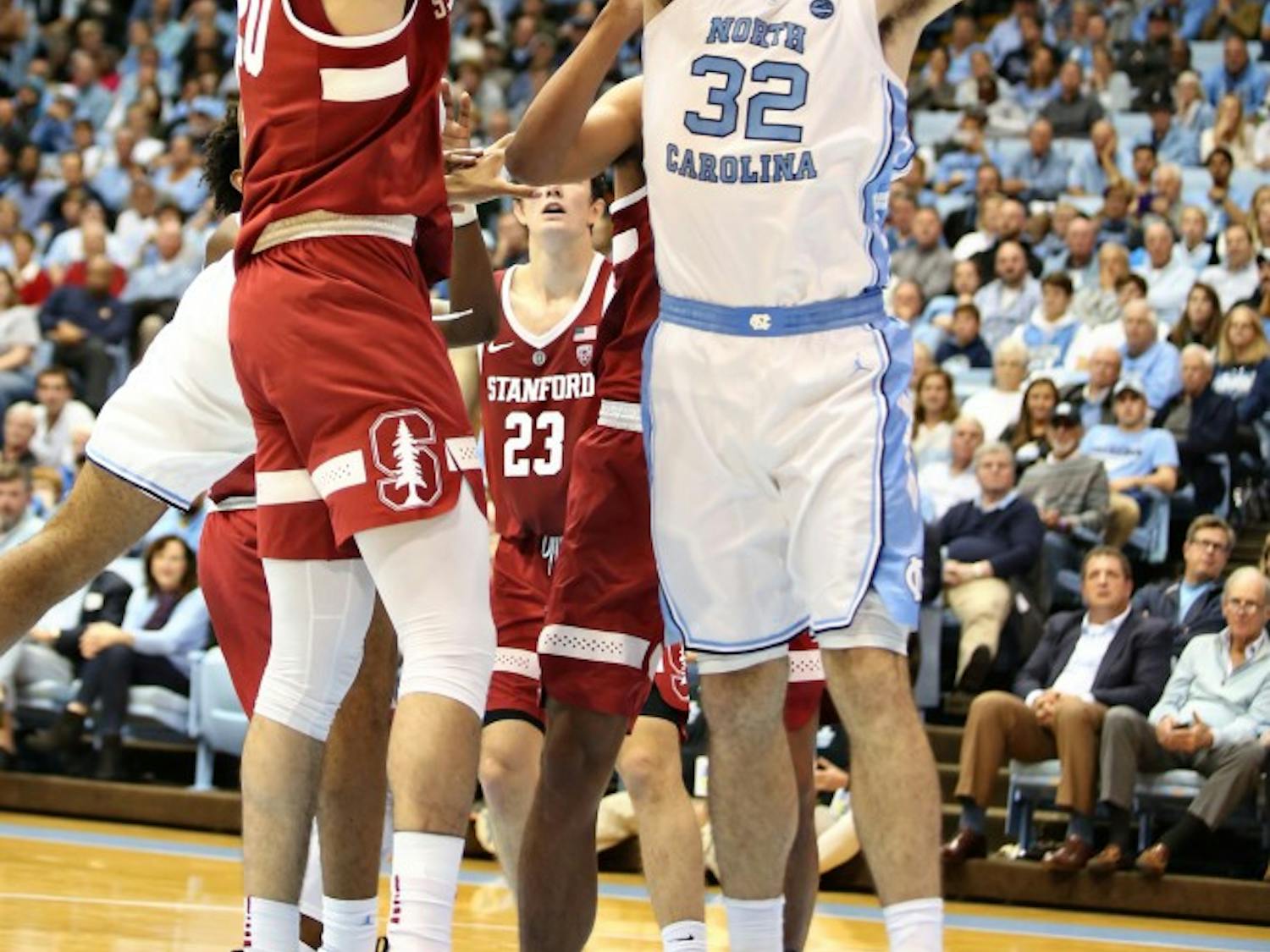 UNC forward Luke Maye (32) guards Stanford center Josh Sharma (20) as he pulls up for a shot in the Dean Smith Center on Monday, Nov. 12, 2018. UNC won 90-72.