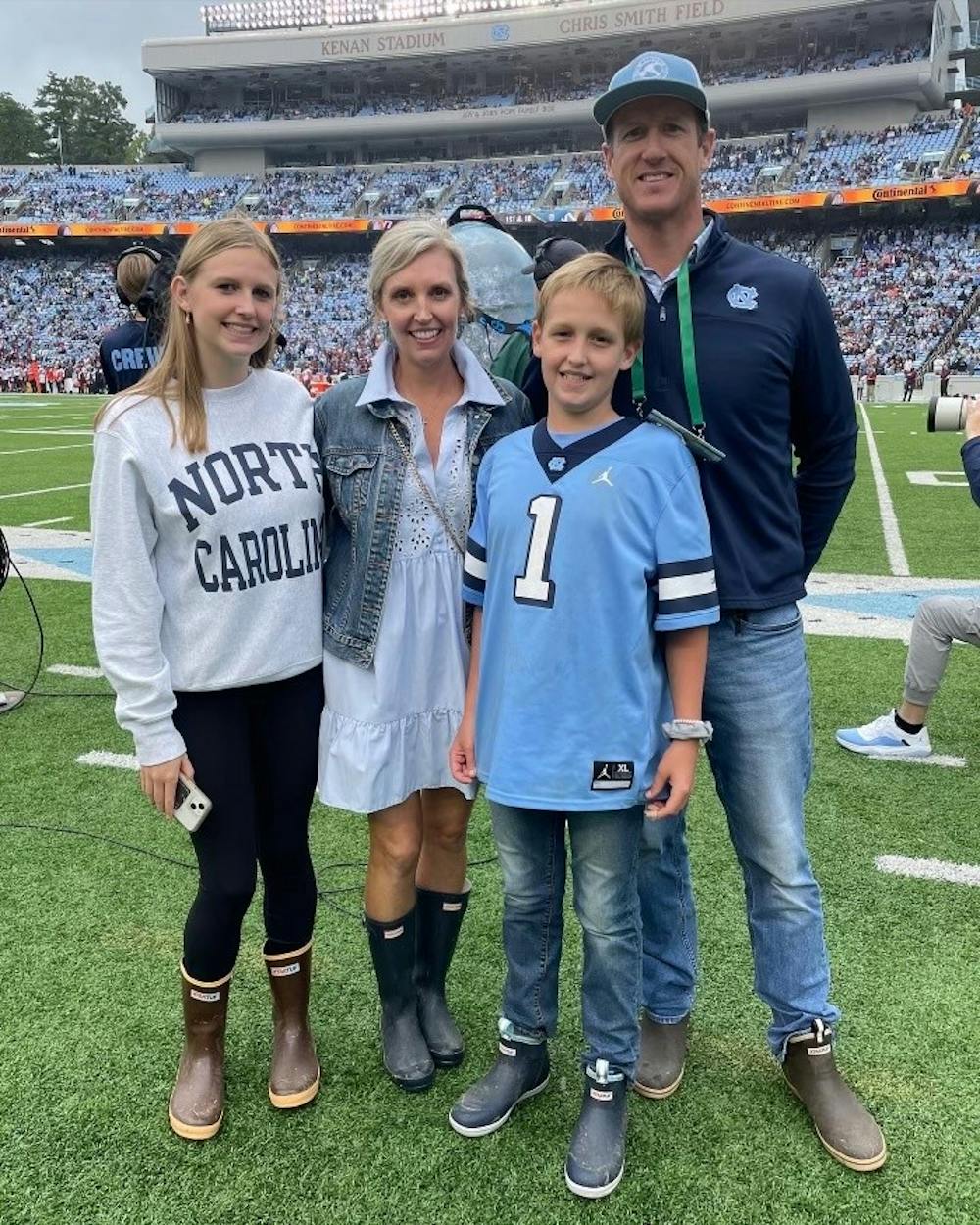 <p>The Fitch family attended the Virginia Tech home football game on Oct. 1, 2022, where Lee Fitch (center) was the UNC Children’s Hospital, “kid champion” of the game. Pictured from left to right: Virginia Fitch, Meredith Fitch, Lee Fitch and David Fitch at Kenan Stadium. Photo by Jon Leggette and courtesy of The Finch Family.</p>