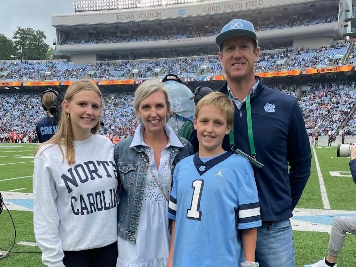 The Fitch family attended the Virginia Tech home football game on Oct. 1, 2022, where Lee Fitch (center) was the UNC Children’s Hospital, “kid champion” of the game. Pictured from left to right: Virginia Fitch, Meredith Fitch, Lee Fitch and David Fitch at Kenan Stadium. Photo by Jon Leggette and courtesy of The Finch Family.