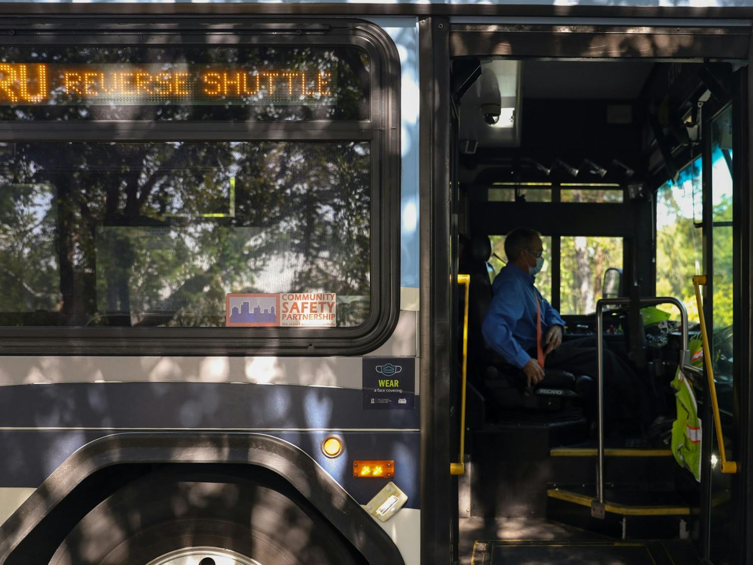 A Chapel Hill Transit bus driver buckles in their seat belt on Wednesday Sept. 15, 2021. Chapel Hill Transit is looking to install temporary changes in order to increase the reliability of the bus system in the wake of a staffing shortage.