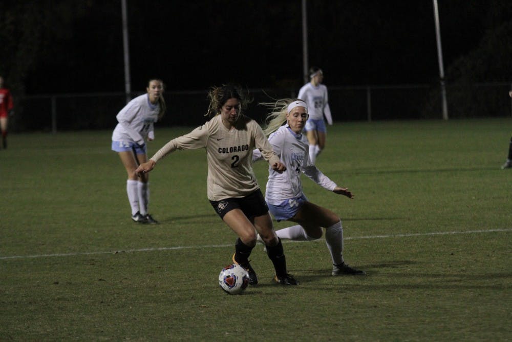 <p>Forward Bridgette Andrzejewski fights for the ball against Colorado in an NCAA Tournament second round match on Friday in WakeMed Soccer Park in Cary.&nbsp;</p>