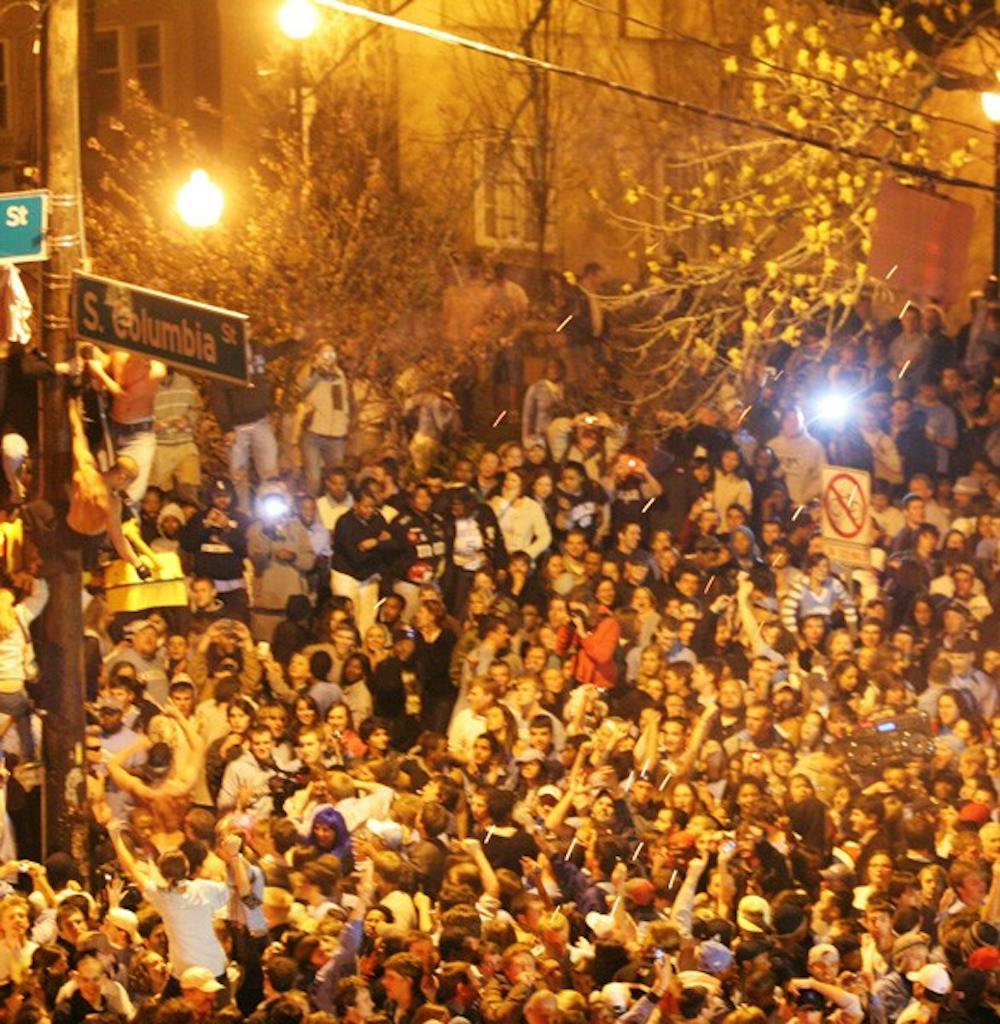 Fans rush Franklin Street in 2009 after men's basketball NCAA Tournament championship win. DTH File/Margaret Cheatham Williams