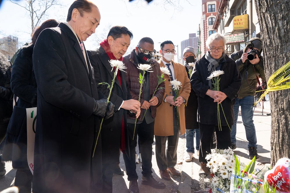 Asian American community leaders place flowers on a memorial for murder victim Christina Yuna Lee after an anti-Asian hate rally in Sarah D. Roosevelt Park on Feb. 15, 2022 in Manhattan, New York. Photo courtesy of Barry Williams/New York Daily News/TNS.