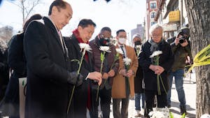 Asian American community leaders place flowers on a memorial for murder victim Christina Yuna Lee after an anti-Asian hate rally in Sarah D. Roosevelt Park on Feb. 15, 2022 in Manhattan, New York. Photo courtesy of Barry Williams/New York Daily News/TNS.