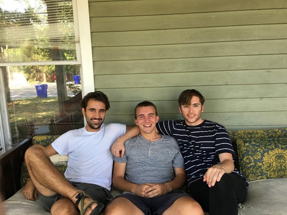 <p>From left, graduate student João Ritter sits with Roof founders Tomas Roy, junior,&nbsp;and Teddy Wilson, a UNC senior. Courtesy of João Ritter.&nbsp;&nbsp;</p>