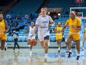 Sophomore guard Alyssa Ustby (1) dribbles the ball at the women's basketball game against NC A&T on Nov. 9 at Carmicahel Arena. UNC won 92-47.