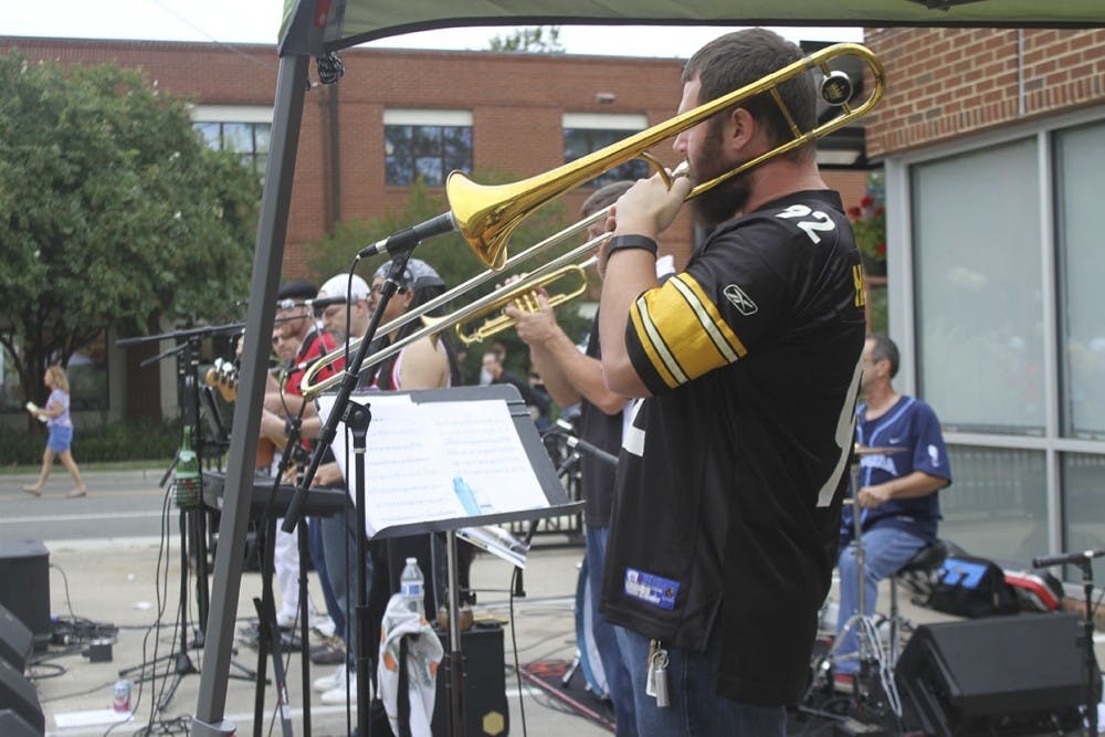 Musicians perform in cloudy conditions at the 2016 Carrboro Music Festival. 