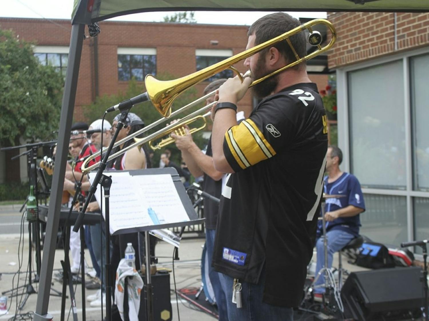 Musicians perform in cloudy conditions at the 2016 Carrboro Music Festival. 