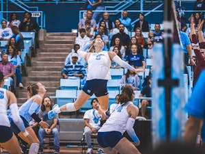 UNC graduate Charley Niego (5) spikes a ball early in the first set of the volleyball match against Boston College on Friday, Oct. 14, 2022. UNC won 3-0.