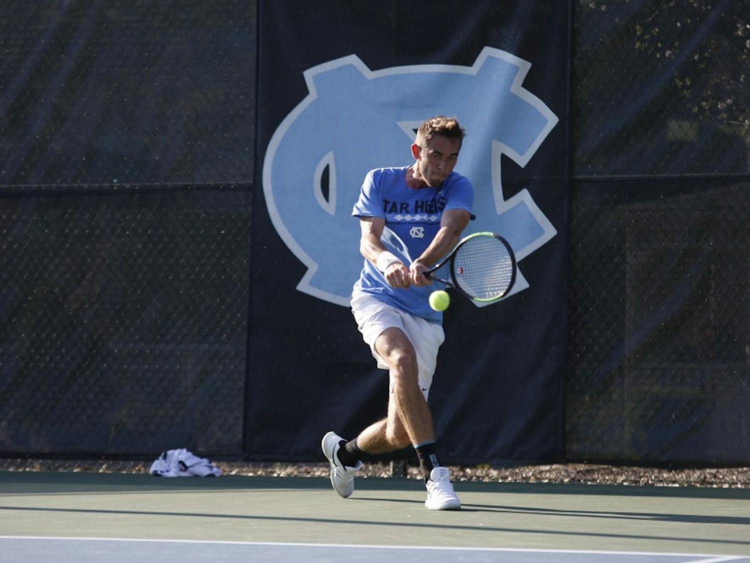 UNC men's tennis sophomore Benjamin Sigouin prepares to return the ball during a singles match against NC State on Wednesday April 3, 2019. UNC beat NC State 4-0.&nbsp;
