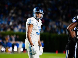 UNC senior wide receiver, Antoine Green (3), watches as the referees confirm his challenged touchdown in Wallace Wade Stadium on Oct. 15, 2022, in UNC’s faceoff against Duke. UNC won 38-35.