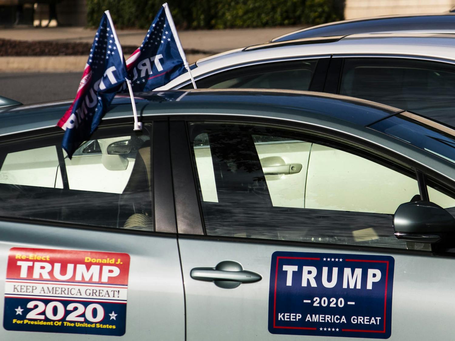 A car decked out in Trump prohpaganda sits at the University Mall shopping center early polling site on Thursday, Oct. 22, 2020.