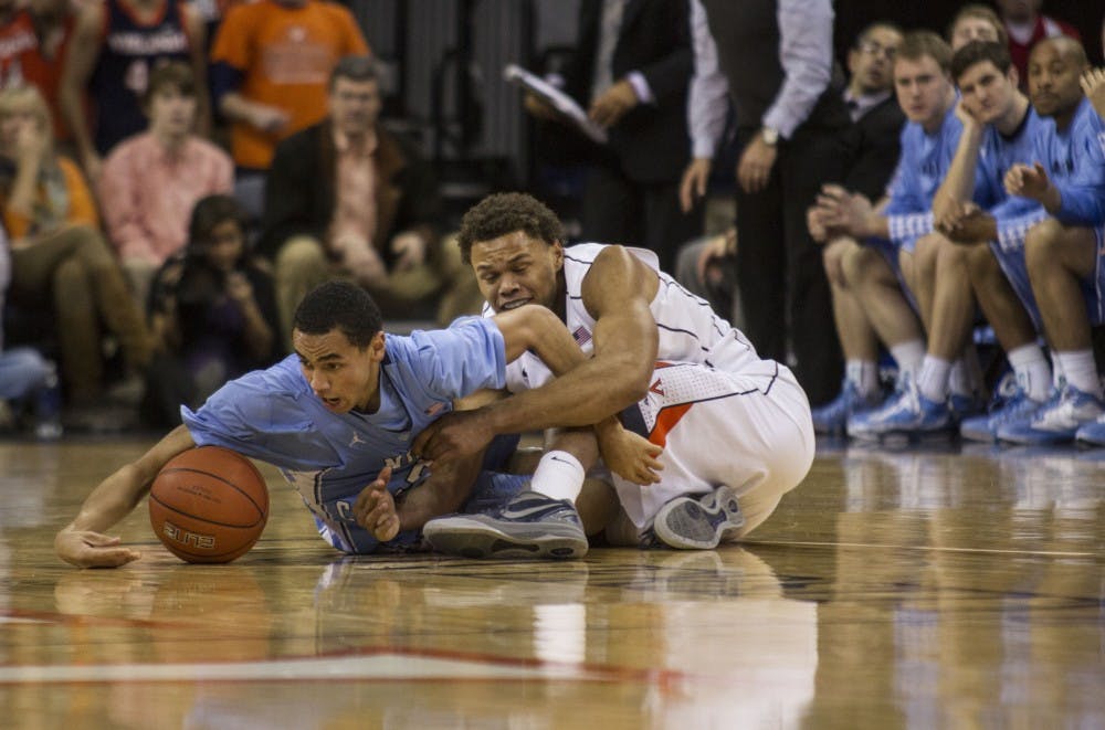 Freshman Marcus Paige fights on the floor for the ball in the first half. 