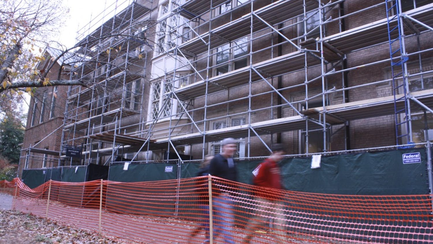 Students walk by construction on Battle, Vance and Pettigrew halls.  The construction project is one of many on UNC’s campus. Most of the projects on campus are funded by the N.C. General Assembly, although some are privately funded. Campus officials are expecting a continued lack of funding since the midterm elections.